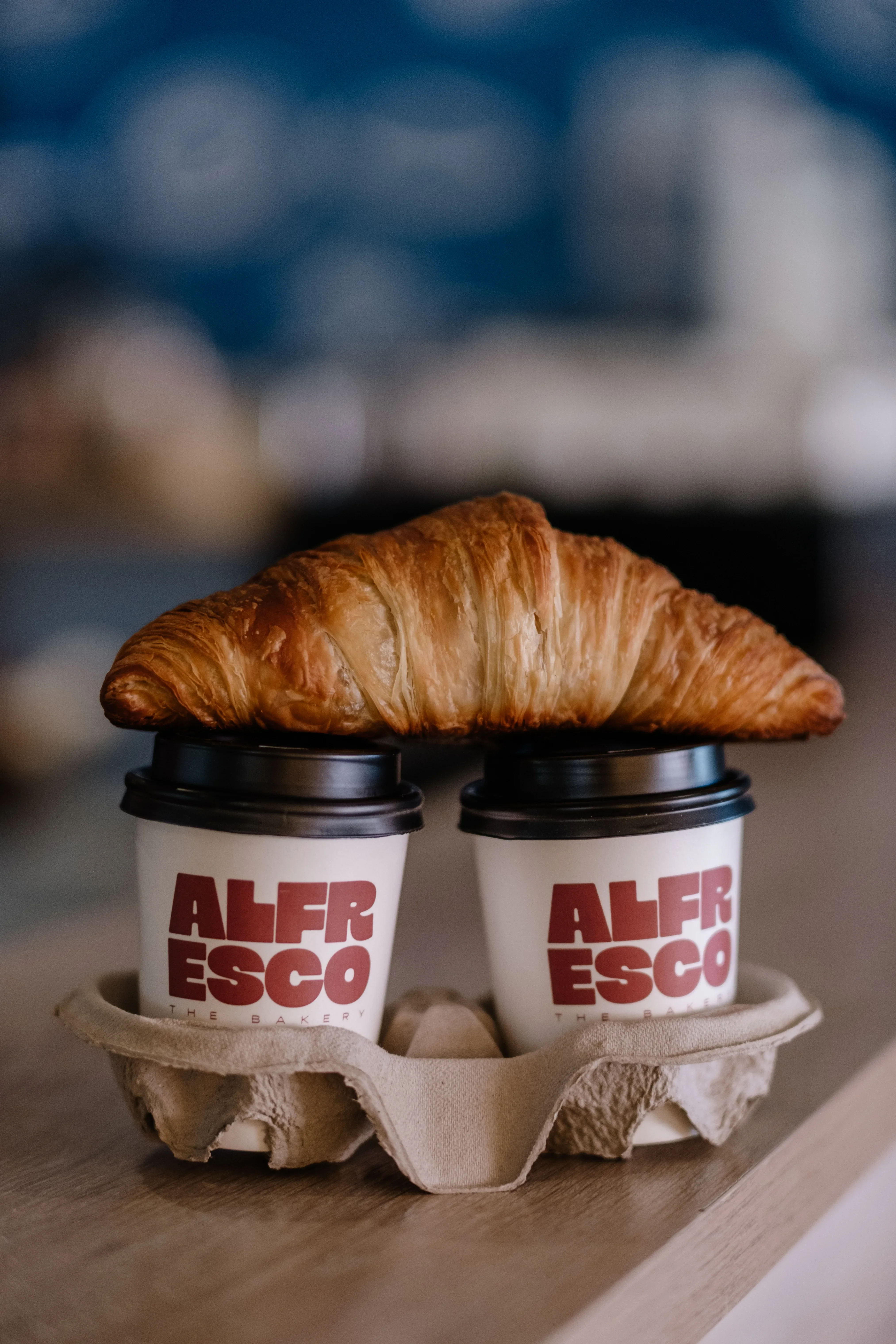 Cups with croissant on top