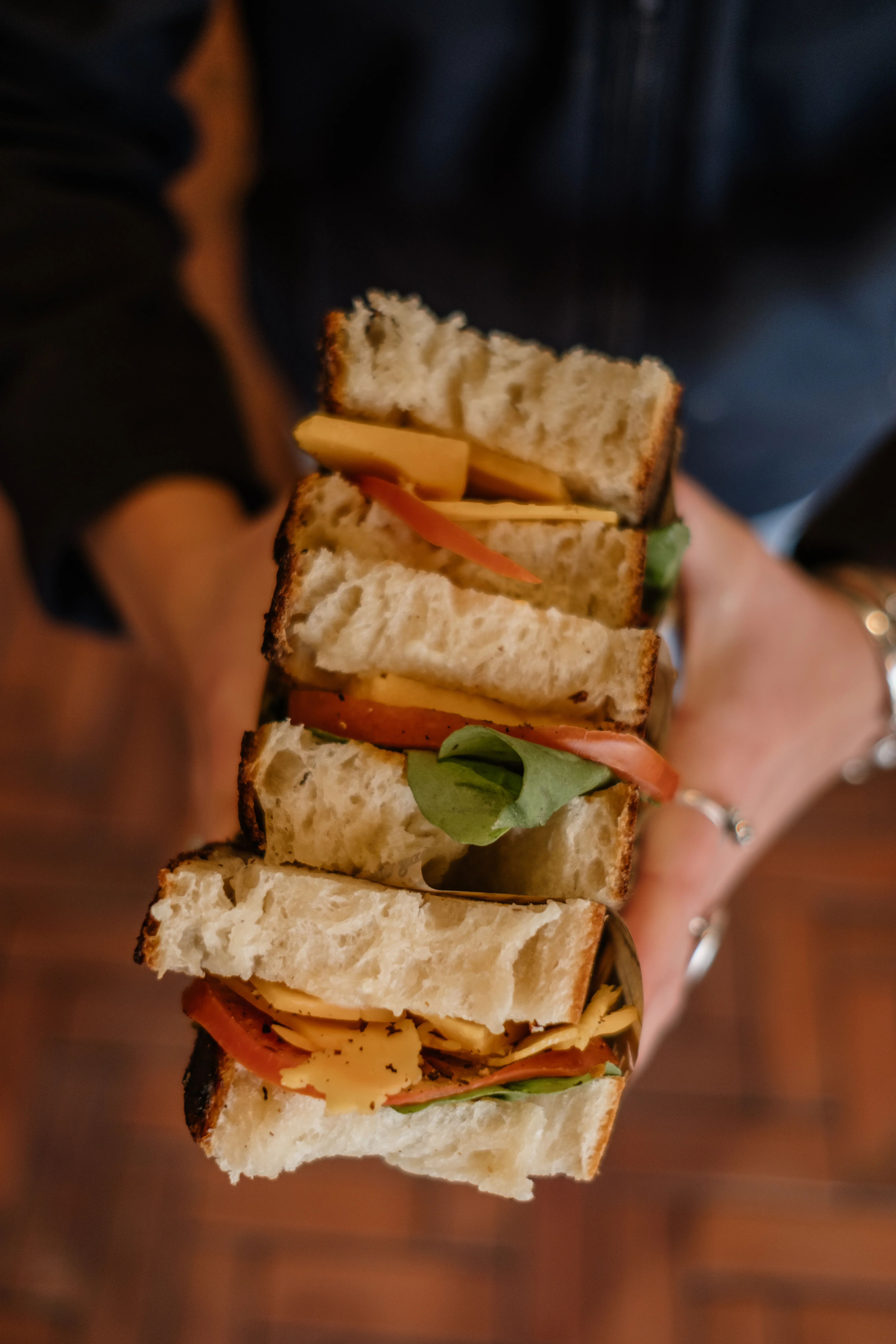 Sambos stacked in hands